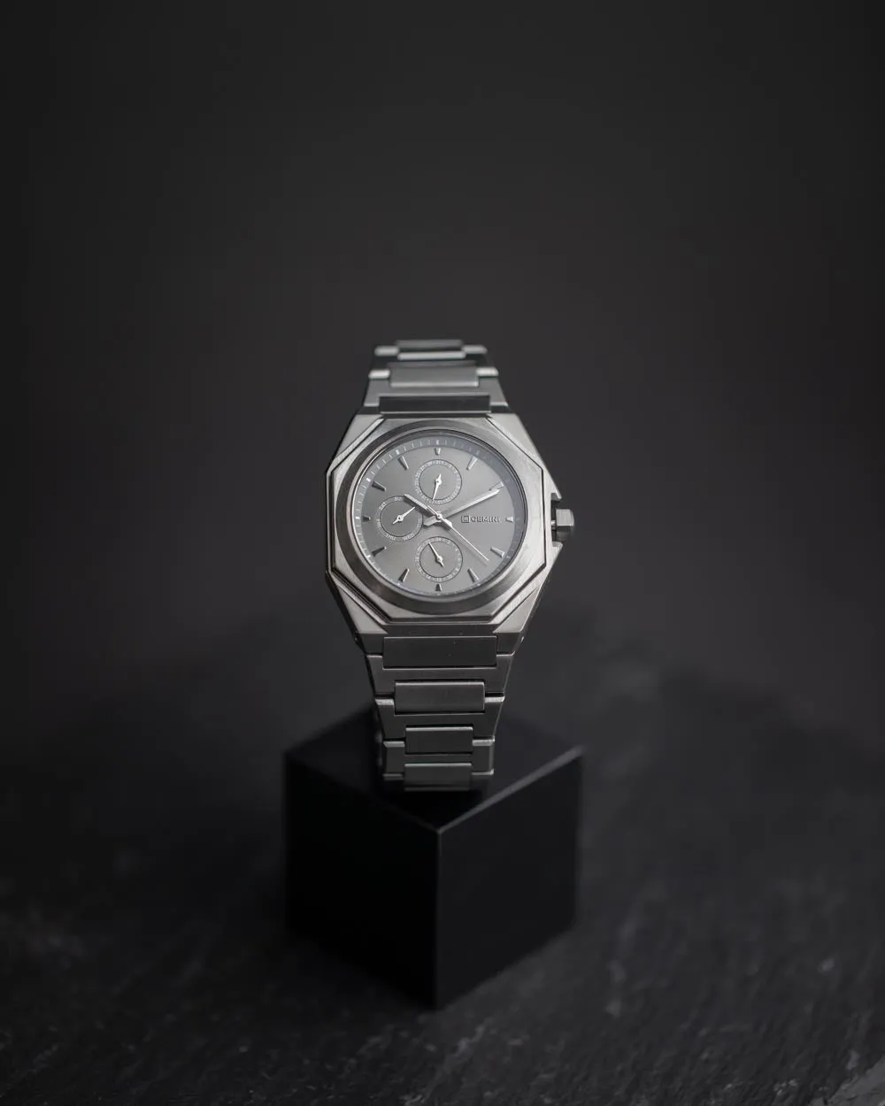 42mm full stainless steel watch with dark grey finish and silver details