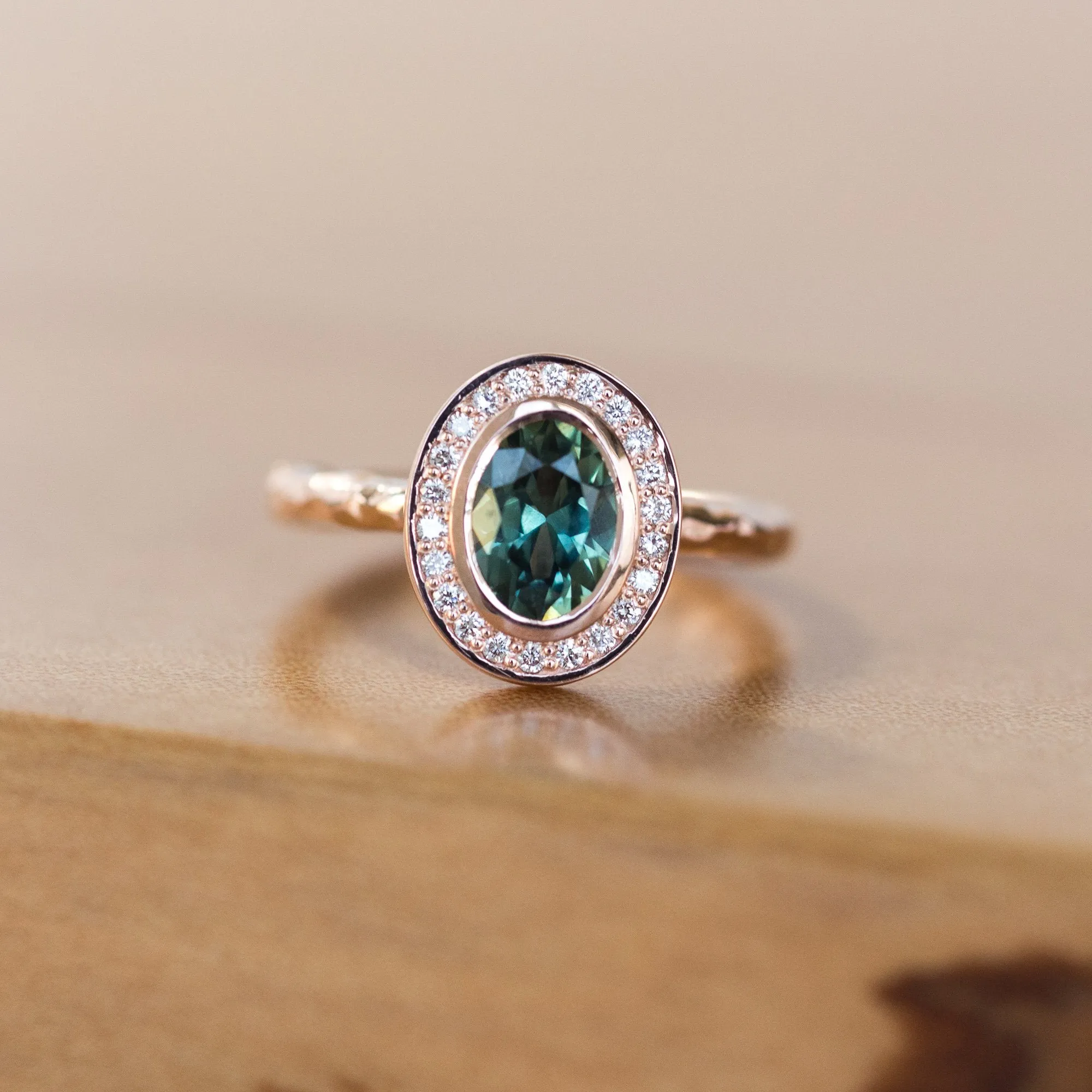 Oval Bezel Set 1.49ct Color Changing Teal Sapphire and Diamond Halo Engagement Ring - 14k Rose Gold Evergreen Band